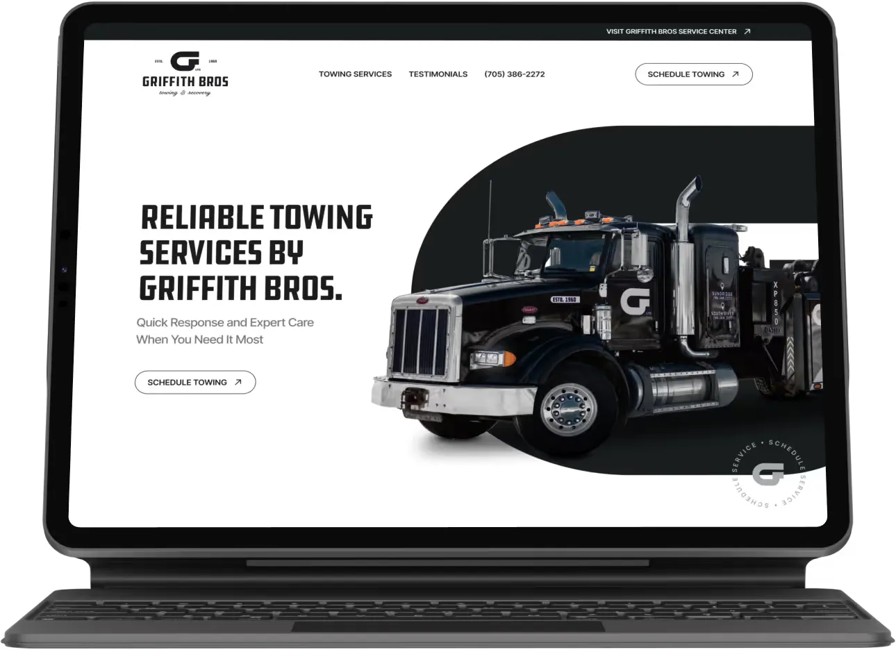 The Griffith Bros. towing site on a tablet, with a tow truck beside the headline “Reliable towing services by Griffith Bros.”